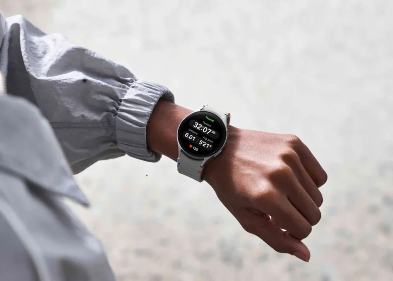 Galaxy Watch 7 on a person's wrist displaying workout metrics, including duration, calories burned, pace, and heart rate.
