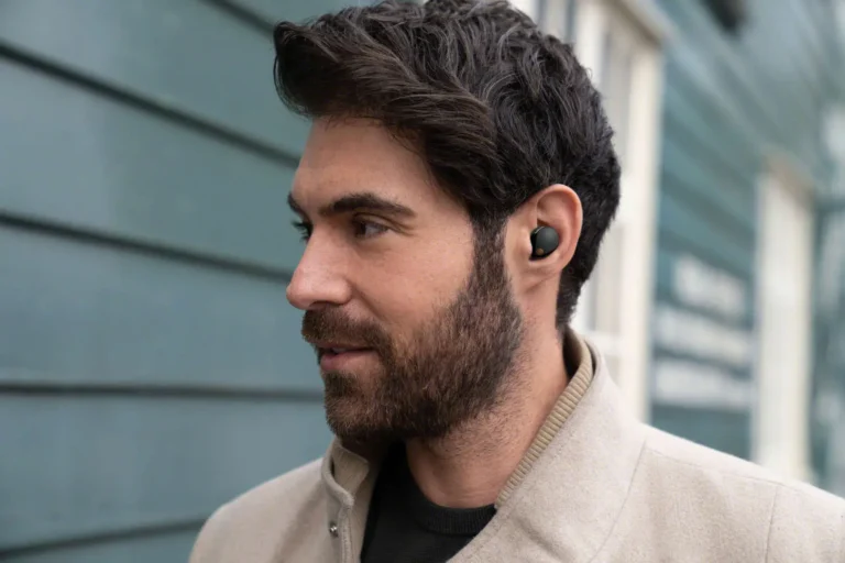 A man wearing Sony WF-1000XM5 earbuds